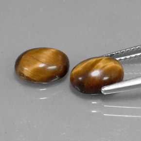 Натуральный коричневый tiger's eye 1,59 карата огранка овал, непрозрачный