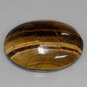 Натуральный коричневый tiger's eye 73,05 карата огранка овал, непрозрачный