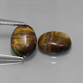 Натуральный коричневый tiger's eye  карата огранка овал, непрозрачный