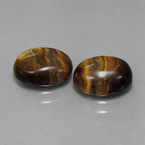 Натуральный коричневый tiger's eye  карата огранка овал, непрозрачный