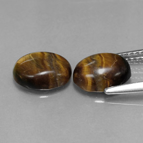 Натуральный коричневый tiger's eye  карата огранка овал, непрозрачный