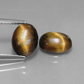Натуральный коричневый tiger's eye  карата огранка овал, непрозрачный