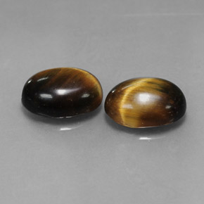 Натуральный коричневый tiger's eye  карата огранка овал, непрозрачный