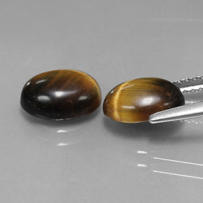 Натуральный коричневый tiger's eye  карата огранка овал, непрозрачный