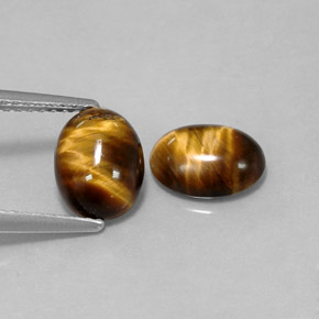 Натуральный коричневый tiger's eye  карата огранка овал, непрозрачный