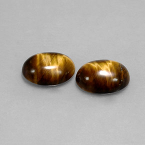 Натуральный коричневый tiger's eye  карата огранка овал, непрозрачный