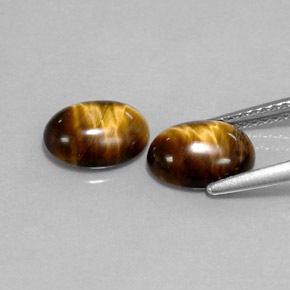 Натуральный коричневый tiger's eye  карата огранка овал, непрозрачный