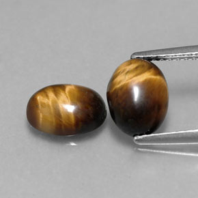 Натуральный коричневый tiger's eye  карата огранка овал, непрозрачный