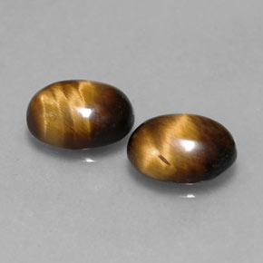Натуральный коричневый tiger's eye  карата огранка овал, непрозрачный