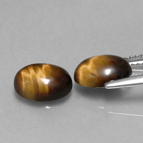 Натуральный коричневый tiger's eye  карата огранка овал, непрозрачный