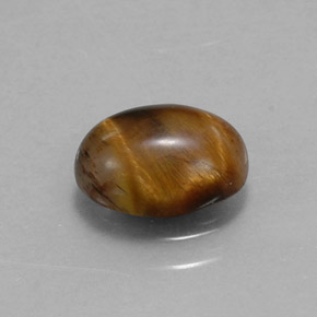 Натуральный коричневый tiger's eye 1,55 карата огранка овал, непрозрачный
