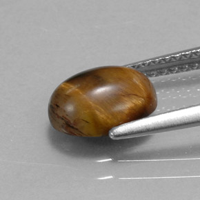 Натуральный коричневый tiger's eye 1,55 карата огранка овал, непрозрачный