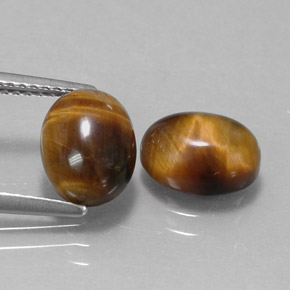 Натуральный коричневый tiger's eye  карата огранка овал, непрозрачный