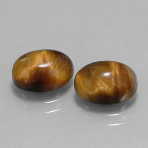 Натуральный коричневый tiger's eye  карата огранка овал, непрозрачный