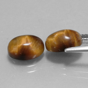 Натуральный коричневый tiger's eye  карата огранка овал, непрозрачный