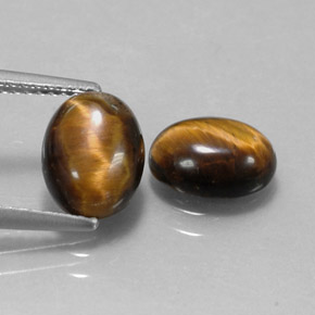 Натуральный коричневый tiger's eye  карата огранка овал, непрозрачный