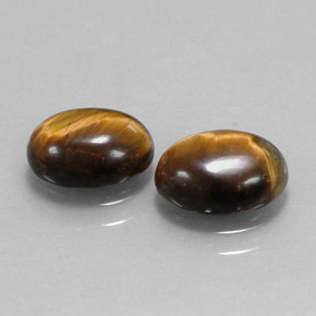 Натуральный коричневый tiger's eye  карата огранка овал, непрозрачный