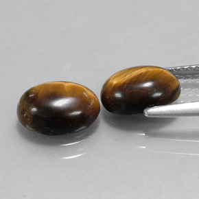 Натуральный коричневый tiger's eye  карата огранка овал, непрозрачный