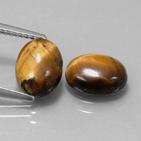 Натуральный коричневый tiger's eye  карата огранка овал, непрозрачный