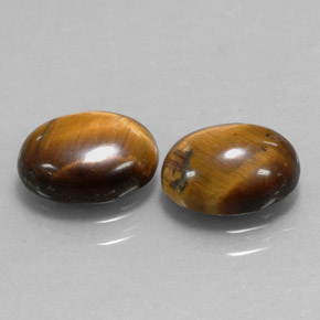 Натуральный коричневый tiger's eye  карата огранка овал, непрозрачный