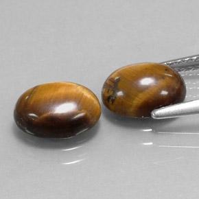 Натуральный коричневый tiger's eye  карата огранка овал, непрозрачный