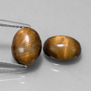 Натуральный коричневый tiger's eye  карата огранка овал, непрозрачный