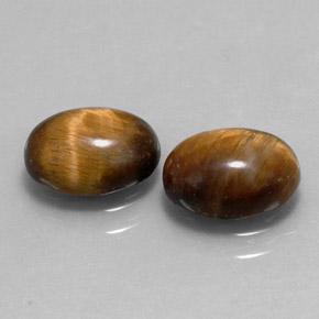 Натуральный коричневый tiger's eye  карата огранка овал, непрозрачный