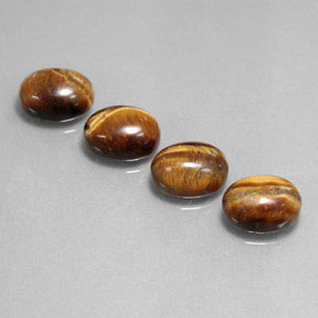 Натуральный коричневый tiger's eye  карата огранка овал, непрозрачный