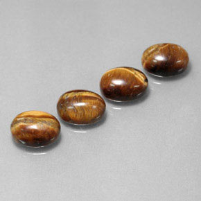 Натуральный коричневый tiger's eye  карата огранка овал, непрозрачный