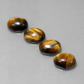 Натуральный коричневый tiger's eye  карата огранка овал, непрозрачный