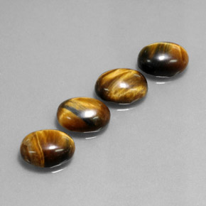 Натуральный коричневый tiger's eye  карата огранка овал, непрозрачный