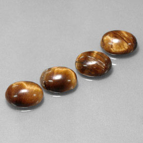 Натуральный коричневый tiger's eye  карата огранка овал, непрозрачный