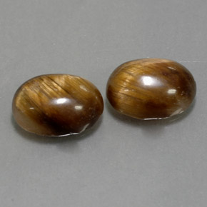 Натуральный коричневый tiger's eye  карата огранка овал, непрозрачный