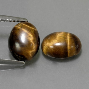 Натуральный коричневый tiger's eye  карата огранка овал, непрозрачный