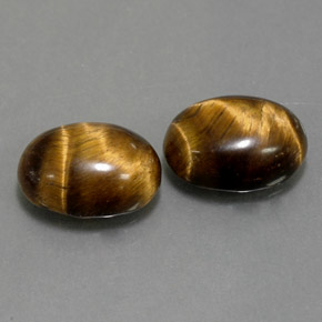 Натуральный коричневый tiger's eye  карата огранка овал, непрозрачный