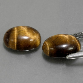Натуральный коричневый tiger's eye  карата огранка овал, непрозрачный