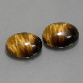 Натуральный коричневый tiger's eye  карата огранка овал, непрозрачный