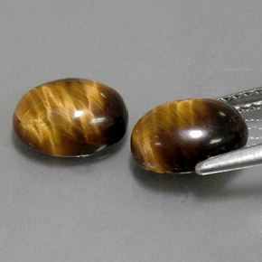 Натуральный коричневый tiger's eye  карата огранка овал, непрозрачный