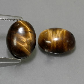 Натуральный коричневый tiger's eye  карата огранка овал, непрозрачный