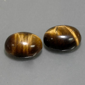 Натуральный коричневый tiger's eye  карата огранка овал, непрозрачный