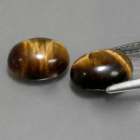Натуральный коричневый tiger's eye  карата огранка овал, непрозрачный
