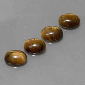 Натуральный коричневый tiger's eye  карата огранка овал, непрозрачный