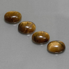 Натуральный коричневый tiger's eye  карата огранка овал, непрозрачный