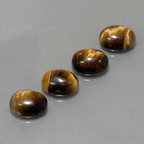 Натуральный коричневый tiger's eye  карата огранка овал, непрозрачный
