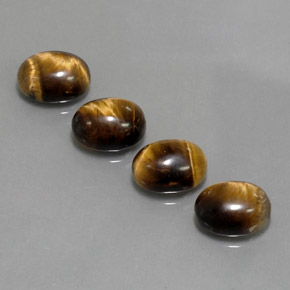 Натуральный коричневый tiger's eye  карата огранка овал, непрозрачный