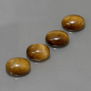 Натуральный коричневый tiger's eye  карата огранка овал, непрозрачный