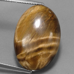 Натуральный коричневый tiger's eye 17,34 карата огранка овал, непрозрачный