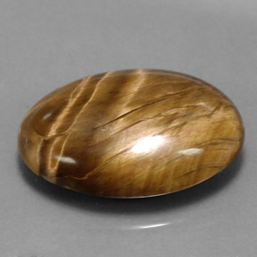 Натуральный коричневый tiger's eye 17,34 карата огранка овал, непрозрачный