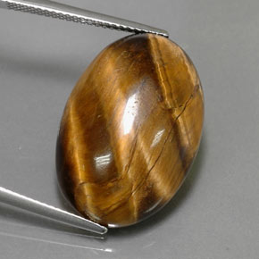 Натуральный коричневый tiger's eye 23,72 карата огранка овал, непрозрачный