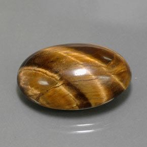 Натуральный коричневый tiger's eye 23,72 карата огранка овал, непрозрачный
